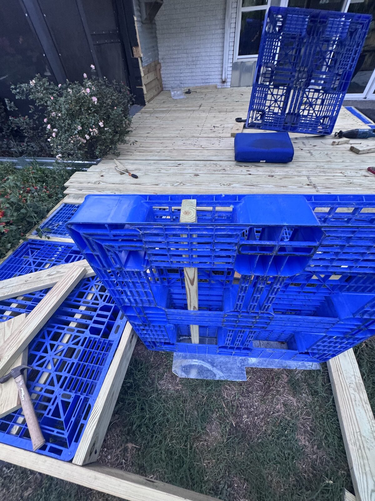 Pallet on edge showing a 2x4 through the forklift opening.